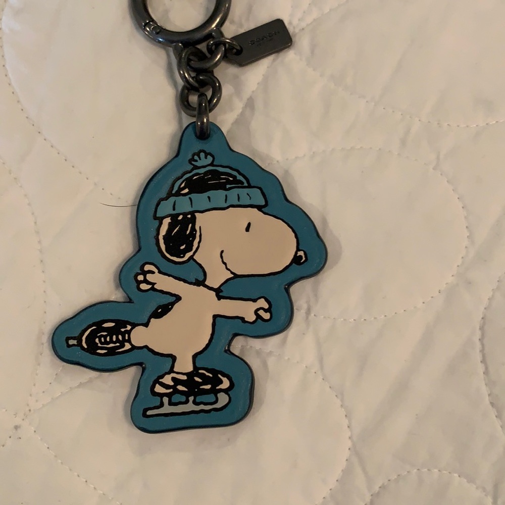 Coach key chain snoopy ice skater